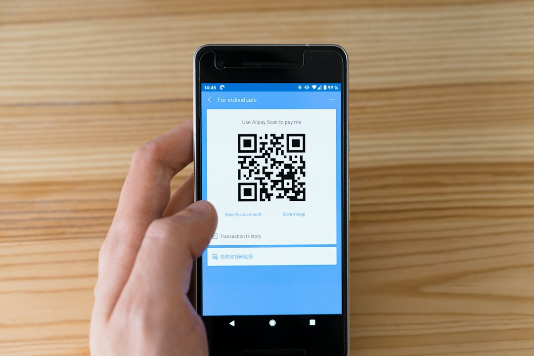 Smartphone displaying a QR code for online fundraising